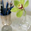 dark blue pencils with a green flower